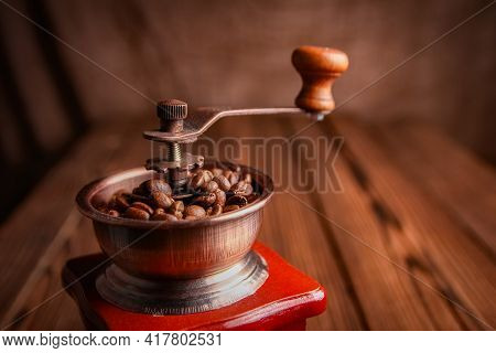 A Coffee Grinder And Coffee A Background