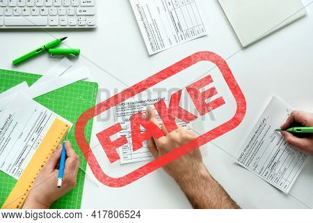 Fake Covid Vaccination Record Card. Covid Scams. Forged Health Certificate With False Vaccination Re
