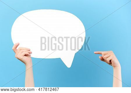 Cropped Images Of Female Hands Holding And Pointing At Blank White Paper Speech Bubble, Isolated On 