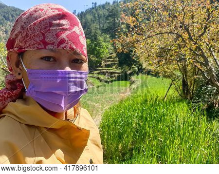 Closeup Shot Of An Indian Young Woman Which Wearing Dhatu (himachal Fashion Accessory) And Face Mask