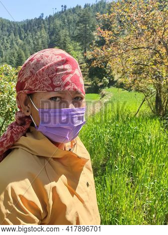 Closeup Shot Of An Indian Young Woman Which Wearing Dhatu (himachal Fashion Accessory) And Face Mask
