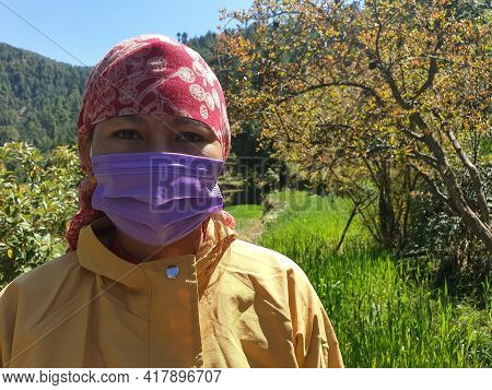 Closeup Shot Of An Indian Young Woman Which Wearing Dhatu (himachal Fashion Accessory) And Face Mask