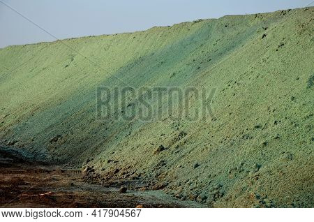 Stabilization Of Slopes By Hydro Sowing. A Mixture Of Wood Pulp And Green Grass Seed Is Sprayed From