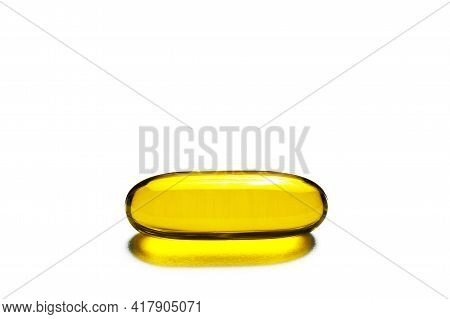 Yellow Single Capsule Isolated On White. Medicine Healthcare Background. Drugs Dose Tablet. Painkill