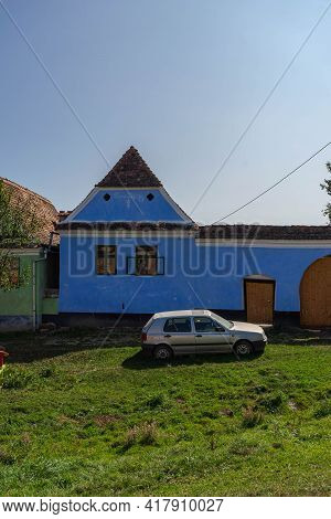 View Of Picturesque Village Viscri In Romania. Painted Traditional Old Houses In Medieval Saxon Vill