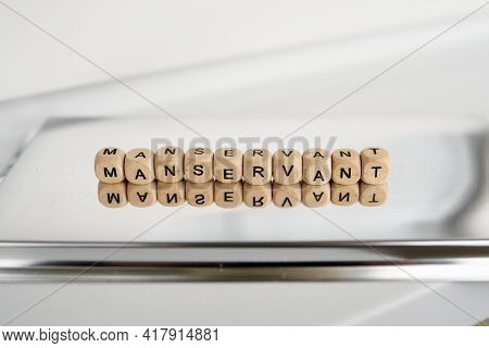 Word Manservant Made By Wooden Cubes With Reflection