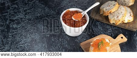 Banner With Recipe For Making An Appetizer With Red Caviar. Bagget, Red Caviar, Dill On A Black Back