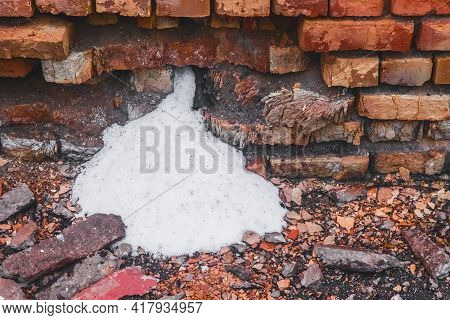 White Ammonia Saltpeter, Fertilizer Woke Up Through The Destroyed Old Brick Wall Of The Industrial W