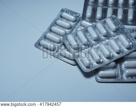 Blister With White Medicine Pills. Prevention Of Coronary Artery Disease. Treatment Of Cerebral Isch