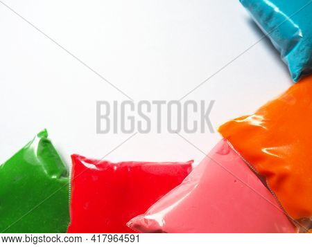 Colorful Kid's Plasticine On White Background, Colorful Dough Modeling Clay. Packing Of Colored Soft