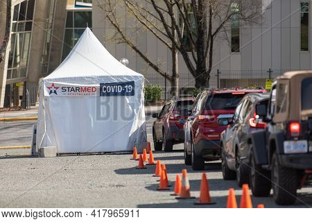 Charlotte, Nc Usa - March 20, 2021: The Waiting Line To Receive The Covid--19 Vaccination From Starm