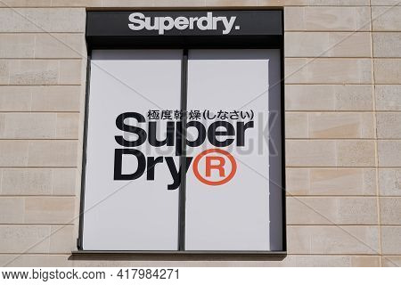 Bordeaux , Aquitaine France - 04 22 2021 : Superdry Logo Brand And Japanese Text Sign Shop Of Store 