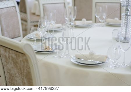 The Banquet Hall With Round Tables, With Cutlery, Clouse View