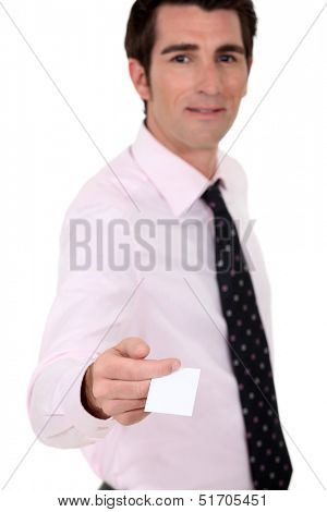 Man holding out his business card