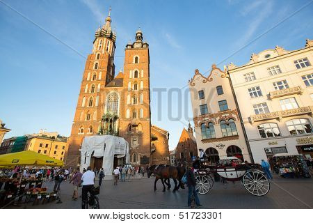 KRAKOW, POLAND - SEPTEMBER 8: View of the Main Square, September 8, 2013 in Krakow, Poland. It dates to the 13th century, and at roughly 40,000 m Ã?ÃÂ¢?? it is the largest medieval town square in Europe.