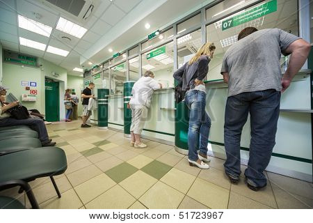 MOSCOW - APR 14: People are queuing for service in Department of Sberbank of Russia on April 14, 2013 in Moscow, Russia.