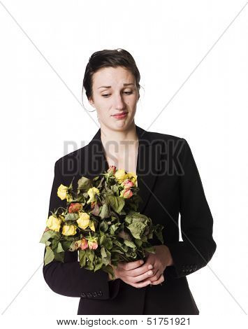 Woman with dead flowers