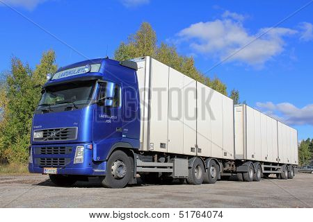 Blue Volvo Truck With Full Trailer