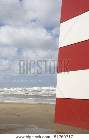 Red and White Landmark on the beach