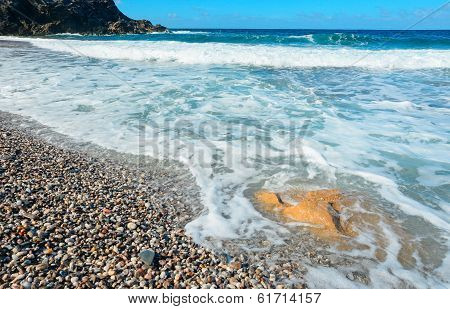 Blue Water And Pebbles