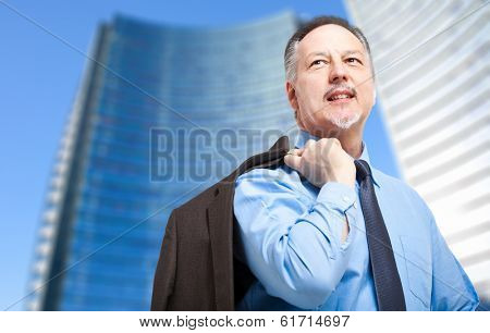 Senior confient businessman in a modern city