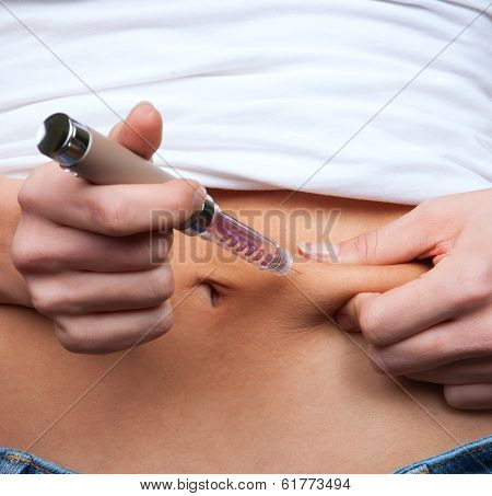Doctor Making Diabetes Patient Insulin Shot By Syringe
