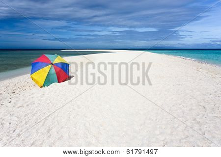 Colorful sunshade on pure tropical white beach, Camiguin island, Philippines