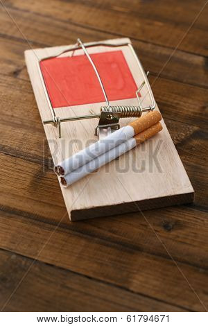 Mousetrap with cigarette, isolated on white