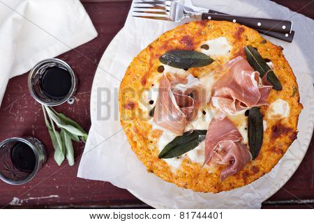 Pasta pie with cheese sauce and sage