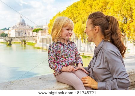 Happy Mother And Baby Girl On Bridge Ponte Umberto I With View O