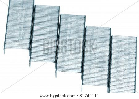 Stack Of Metal Staples. Isolated On A White.