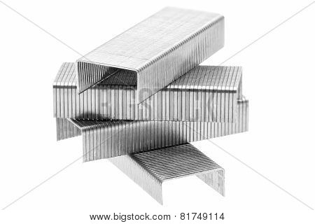 Stack Of Metal Staples. Isolated On A White.