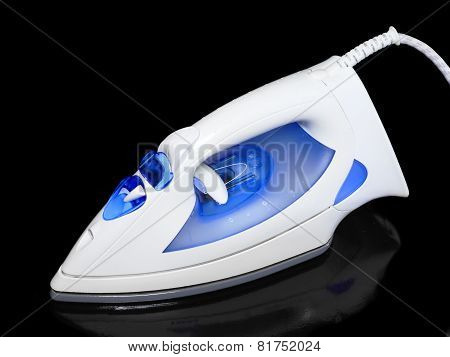 Electric Iron On Black Background.
