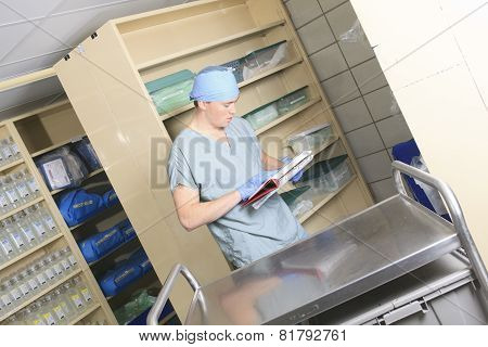 Medical staff sterilizing hands and arms before surgery