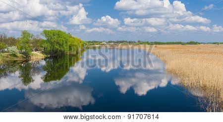 Spring panoramic landscape with river Oril