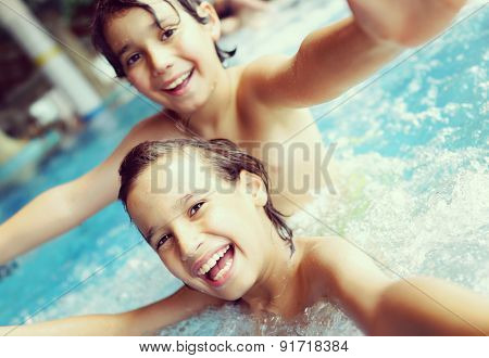 Kids in pool having fun