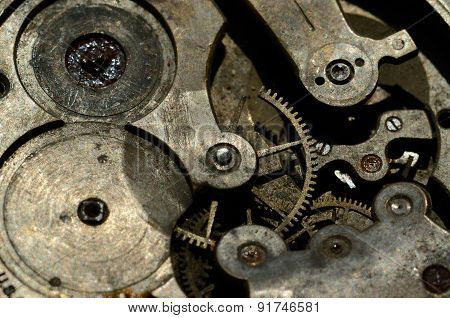 Closeup Of Cogweels In Clockwork, Grunge Background For Steampunk Engineering Design