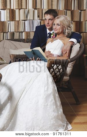 The Bride And Groom On The Wicker Furniture