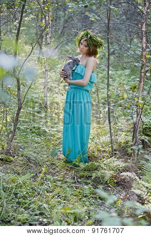 Beautiful Model With A Gray Rabbit In Her Arms