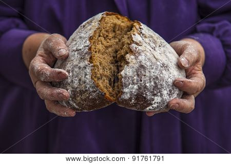 An Elderly Woman Model With Black Bread