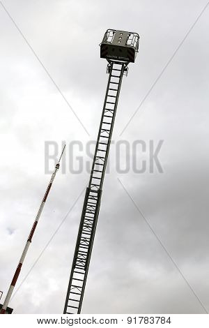 Firefighters In The Fire Truck Basket During The Practice Of Training