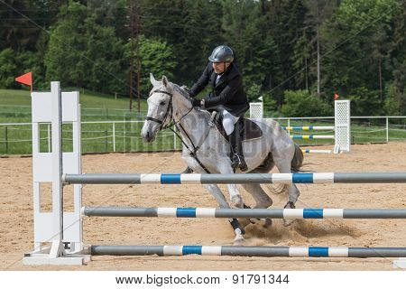 Horseman Is Mastering A Recalcitrant White Horse