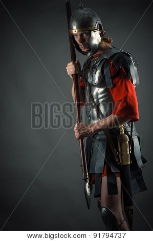 Roman soldier in armor with a spear in hand