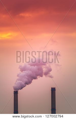 Industrial cityscape with coal power plant and smoke stacks