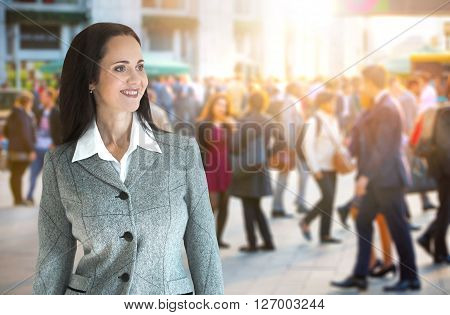 Beautiful business woman portrait and people blur on the background. Modern business life concept