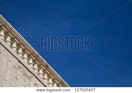 A terracce watching a blue summer sky