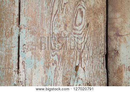 Wood panels with paint damaged by the weather