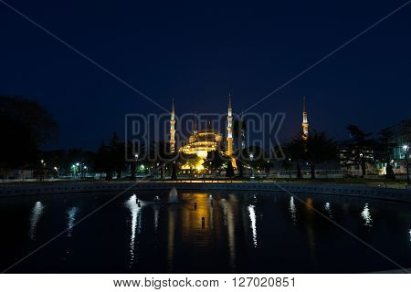 fountain on Sultanahmet square in front of the Blue mosque (Sultan Ahmed Mosque)in Istanbul in the evening