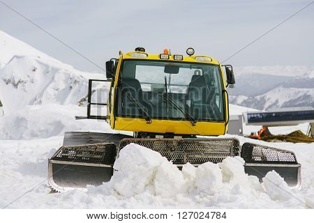 SNOWCAT in the mountains on ski slope