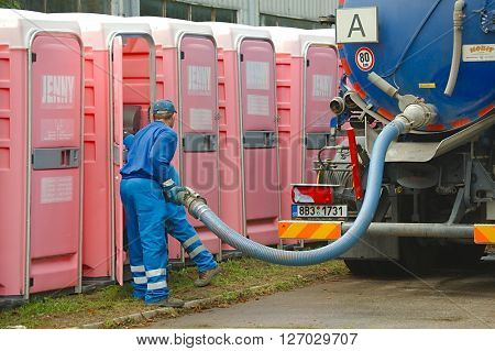 HODONIN, CZECH REPUBLIC - AUGUST 17: Cleaning of the mobile toilets at Made of Metal, August 17th 2014.